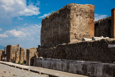 The streets of pompeii made of large blocks of black volcanic rocks