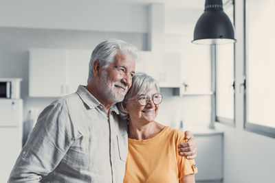 Portrait of senior woman standing at home