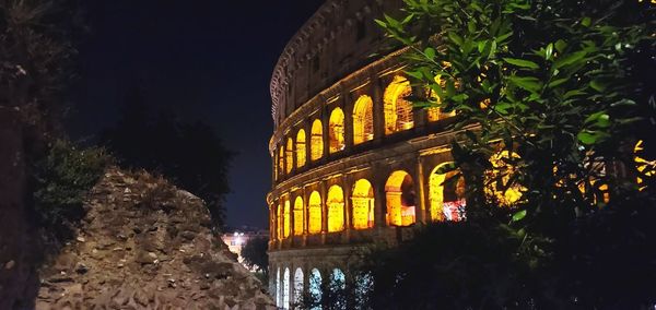 Low angle view of illuminated building at night