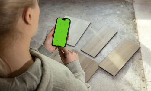 Close-up of woman holding wooden blocks