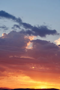 Low angle view of dramatic sky during sunset