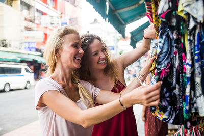 Friends shopping in city