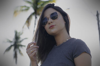 Portrait of young woman wearing sunglasses