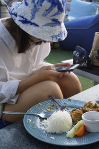 Midsection of woman eating food