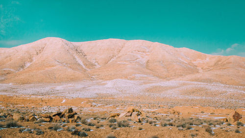 Scenic arid landscape against blue sky