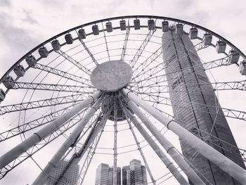 Low angle view of ferris wheel against sky