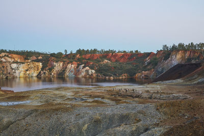 Contaminated pond lake of an old abandoned mine red landscape in mina de sao domingos