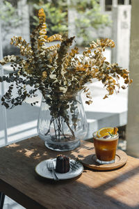 Vase with breakfast on table in restaurant