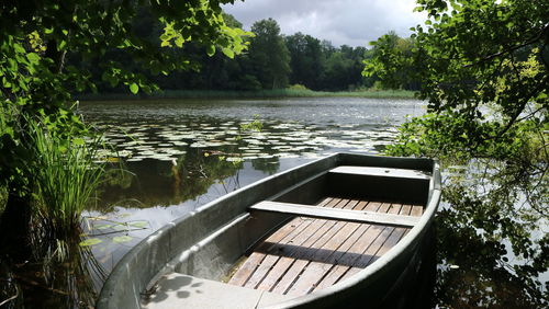 Abandoned boat in lake