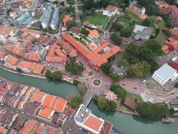 High angle view of river amidst cityscape