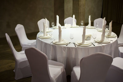 Chairs arranged at table during wedding ceremony