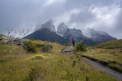 Scenic view of field and mountains against sky