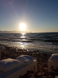 Scenic view of sea against clear sky during sunset