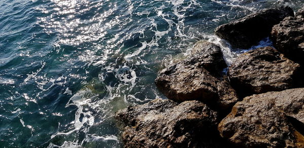 High angle view of rock formation at sea