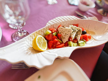 High angle view of fruits in plate on table