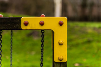 Close-up of rusty metal chain in playground