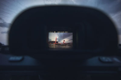 Reflection of people on car window