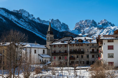 Buildings against sky during winter