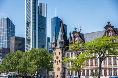 Low angle view of buildings against blue sky