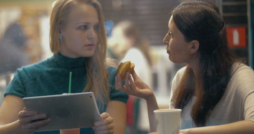 Portrait of young woman using smart phone