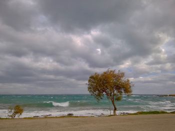 Scenic view of sea against cloudy sky