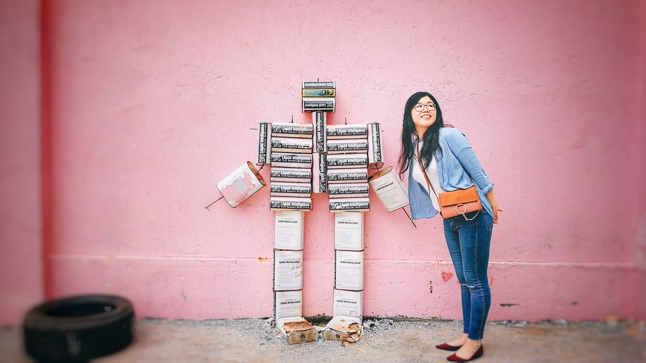 one person, wall - building feature, real people, full length, young women, young adult, standing, casual clothing, lifestyles, leisure activity, long hair, hairstyle, front view, day, hair, portrait, women, built structure, architecture, outdoors, beautiful woman, contemplation