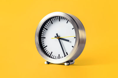 Close-up of clock against white background