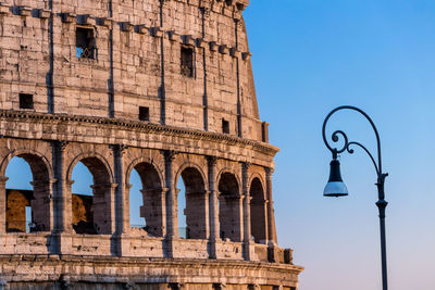 Low angle view of coliseum against sky