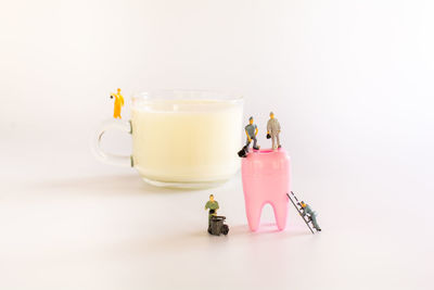 Close-up of tea cup on table against white background