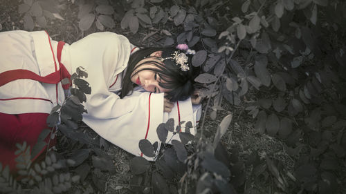 High angle view of woman lying down on floor
