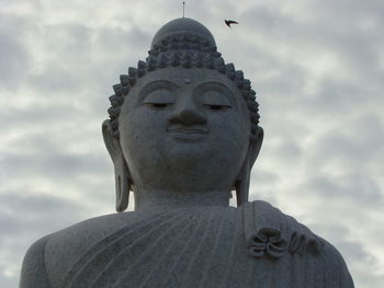 Low angle view of statue against sky