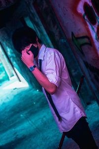 High angle view of woman standing by pink umbrella