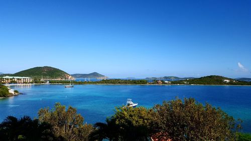 Scenic view of sea against clear blue sky