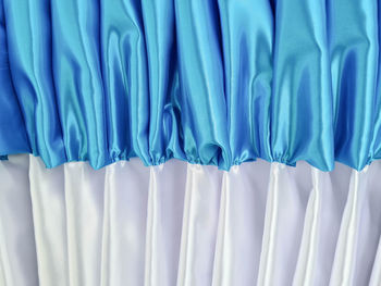 Close-up of white fabric against blue background