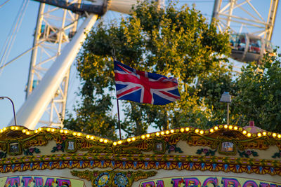 Low angle view of amusement park ride against sky