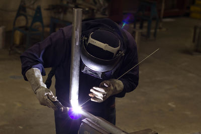 Man working on metal