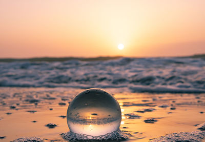 Close-up of sea during sunset