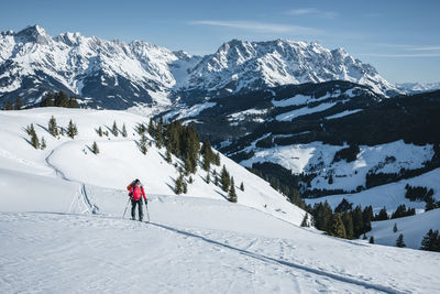 Man skiing on snowcapped mountain