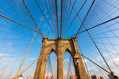 Low angle view of brooklyn bridge against sky