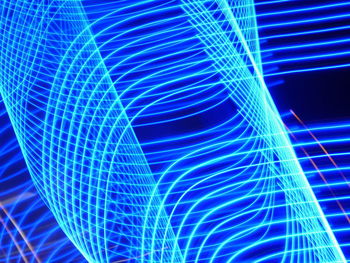 Abstract image of light trails against black background