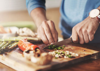 Midsection of person preparing food