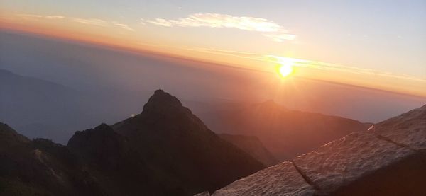 Scenic view of mountains against sky during sunset