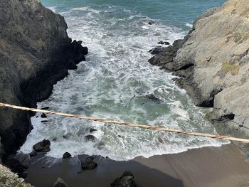 High angle view of rocks in sea