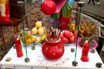 Various fruits in glass on table