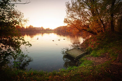 Scenic view of lake at sunset