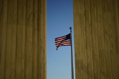 American flag and columns at the entrance of supreme court, washington, dc, usa