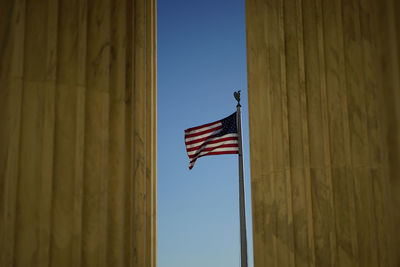 Low angle view of flag against sky