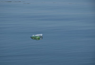High angle view of bottle in river