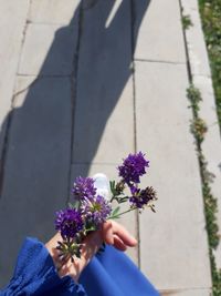 Midsection of woman holding bouquet