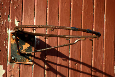 Close-up of rusty metal against wall